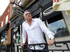 Vito Maggio looks on as construction crews begin the work on Wyandotte Street in Walkerville in Windsor on Monday, July 7, 2014. The street will be closed for the next couple months as crews replace waterlines and improve streets and sidewalks.             (Tyler Brownbridge/The Windsor Star)