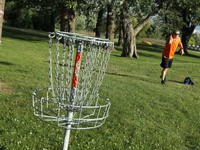 Ron Hebert putts during a round of disk golf at Lakewood Park in Tecumseh on July 15, 2014.