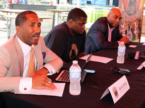 Windsor Express owner Dartis Willis, from left, forward DeAndre Thomas and head coach BIll Jones answer questions during a news conference at the Festival Plaza in Windsor on Friday, July 11, 2014. (Tyler Brownbridge/The Windsor Star)