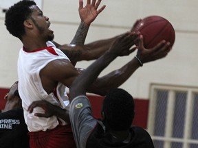 Gary Gibson, 27, from Windsor, drives to the net during the Windsor Express tryout camp for Canadian players at the Rose City Islamic Centre, Sunday, July 6, 2014.  (DAX MELMER/The Windsor Star)