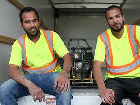 Brothers Jihad Zaher, 24, and Sam Zaher, 21, co-owners of GCPR Conctracting, are pictured at a job site, Monday, July 28, 2014.  They are considering purchasing the new Ford F-Series pickup in the fall.  (DAX MELMER/The Windsor Star)