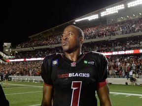 Ottawa Redblacks Henry Burris (1) looks on after the end of CFL action at TD Place in Ottawa on Friday, July 18, 2014. The Ottawa Redblacks beat the Toronto Argonauts 18-17 in their first home game. THE CANADIAN PRESS/Justin Tang