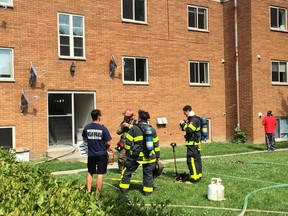 Firefighter work at the scene of a fire at an apartment building in the 2400 block of Rivard. No injuries reported. (Tyler Brownbridge/The Windsor Star/Twitpic)