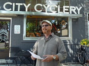 Chris Holt holds a press conference in front of the City Cyclery in Windsor to announce he is running for city council in Ward 4 on Thursday, July 10, 2014.         (Tyler Brownbridge/The Windsor Star)