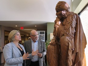 TECUMSEH, ONTARIO- JULY 25, 2014 - Provincial NDP leader Andrea Horwath met with Tecumseh mayor Gary McNamara on Friday, July 25, 2014, to discuss the Bonduelle fire aftermath. The mayor shows Horwath a sculpture of Chief Tecumseh in the town hall.  (DAN JANISSE/The Windsor Star)