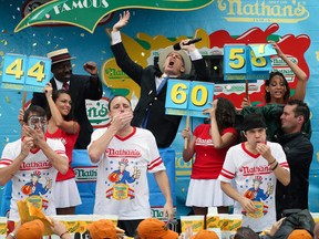 The Nathan's Famous Fourth of July International Hot Dog Eating contest at Coney Island, Friday, July 4, 2014, in New York. At a similar contest in South Dakota, a man choked to death on Friday.