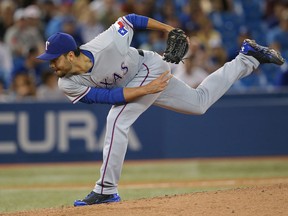 The Detroit Tigers have picked up all-star reliever Joakim Soria from the Texas Rangers. In this file photo, Soria delivers a pitch during a game between the Rangers and the Toronto Blue Jays on July 18, 2014. (Tom Szczerbowski / Getty Images)