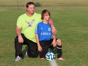 Jeremy Blair and his son Kaidyn Blair are pictured on July 30, 2014. (JASON KRYK/The Windsor Star)