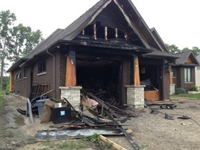 The aftermath of a garage fire at a residence on Serenity Circle in LaSalle on July 16, 2014. (Nick Brancaccio / The Windsor Star)