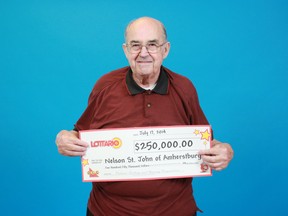 Amherstburg resident Nelson St. John with his $250,000 prize cheque from playing Lottario. (Handout/The Windsor Star)