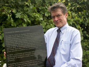 Paul Bunnett-Jones, president of the Leamington-Mersea Historical Society, with a plaque that will be unveiled Saturday at 2 p.m. at the Mersea Municipal Park on Point Pelee Drive to commemorate a July 14, 1814 deadly skirmish at Sturgeon Creek. (Dylan Kristy/The Windsor Star)