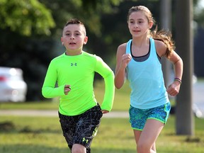 Malikye Good, 8, and his sister Lola Good, 11, are preparing for a kids marathon. They are shown Wednesday, July 30, 2014, near their Amherstburg, ON. home. (DAN JANISSE/The Windsor Star)