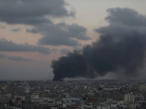 Smoke from an Israeli strike rises over Gaza City, Friday, July 25, 2014. Israel says the goal of its operation is to destroy Hamas military tunnels under the Gaza-Israel border and to halt rocket fire from Gaza on Israeli communities. (AP Photo/Lefteris Pitarakis)