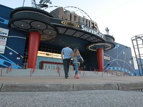 A man and woman walk up to the front door of the Silver City movie theatre on Walker Road in Windsor, Ontario on July 23, 2014.  (JASON KRYK/The Windsor Star)