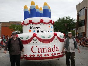 An inflatable birthday cake celebrating Canada's 147th birthday is paraded down Wyandotte St. East during the Windsor Canada Day Parade, Tuesday, July 1, 2014.  (DAX MELMER/The Windsor Star)