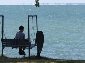In this file photo, a young boy sits on the shore of Pelee Island, Ont. June 14, 2012.  (DAN JANISSE/The Windsor Star)