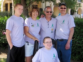 Scott Simon, left, Patti Praill, Marc Praill and Wally Maxson stand behind Jacob Brancheau at the Gift of Life life walk July 26, 2014 at Belle Isle Park, Mich. The Praills met with the three recipients of their daughter Pamela's donated organs. (Photo courtesy of Patti Praill)