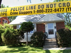 Police tape surrounds Gertrude Hawley's residence at 955 Reedmere Rd. on June 26, 2014. (Dan Janisse / The Windsor Star)