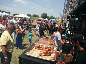 People line up for ribs and chicken at the 5th annual Amherstburg Rotary Ribfest at Centennial Park, Sunday, July 6, 2014.  (DAX MELMER/The Windsor Star)