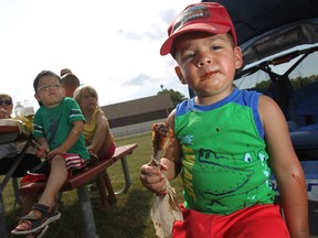 Rubin Gordon, 2, gets a taste of some ribs while at the Amherstburg Rotary Ribfest at Centennial Park, Sunday, July 8, 2012.   (DAX MELMER/The Windsor Star).