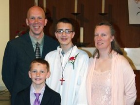 This undated photo released by Jim Bieniewicz shows his brother, soccer referee John Bieniewicz, 44, top left, with his family. Bieniewicz was attacked while officiating at an adult league game in the Detroit suburb of Livonia, Mich., on Sunday, June 29, 2014. Bieniewicz lost consciousness and died Tuesday, July 1, 2014, at a hospital. (AP Photo/Jim Bieniewicz)