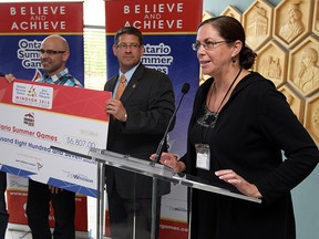 Bigg Wiggle's John Drew and Dave LaBute are joined by Michael Chantler and Nora Romero (right) during a press conference for the Ontario Summer Games at city hall in Windsor on Friday, July 11, 2014. (Tyler Brownbridge/The Windsor Star)