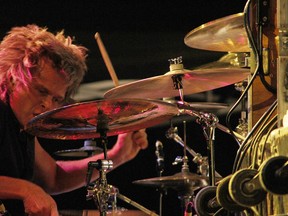 The Tea Party drummer, Jeff Burrows, performs with his bandmates at the Riverfront Festival Plaza, Saturday, July 5, 2014. The Tea Party headlined on the second night of the Fork & Cork festival. (RICK DAWES/The Windsor Star)