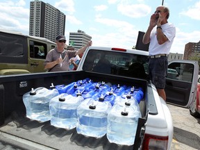 Doug Hayes co-ordinates the transportation for water to Detroit from Windsor on Thursday, July 24, 2014.            (Tyler Brownbridge/The Windsor Star)