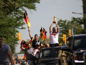 Germany fans celebrate down Ouellette Avenue in a sort of impromptu parade after beating Argentina 1-0 in the FIFA World Cup finals, Sunday, July 13, 2014. The game ended in overtime. (RICK DAWES/The Windsor Star)