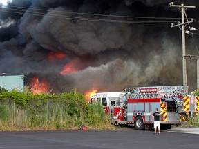 A Windsor fire truck at the scene of the factory blaze at 9152 Tecumseh Rd. East on June 25, 2014. (Jason Kryk / The Windsor Star)