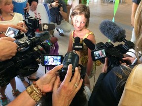 Adventure Bay's 100,000th visitor talks to the media on Thursday, July 17. (DAN JANISSE / The Windsor Star)