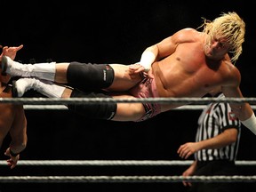 Dolph Ziggler, right, gives a flying kick to Fandango at the WWE Live Summerslam Heatwave Tour at the WFCU Centre, Friday, July 4, 2014.  (DAX MELMER/The Windsor Star)