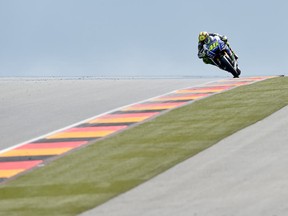 A Yamaha rider during MotoGP practices in Hohenstein-Ernstthal, Germany, on July 12, 2014. (Jens Meyer / Associated Press)