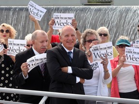 With friends and family by his side, Howard Weeks, 65, centre, announces he will seek election in Ward 4.  Weeks, son of former Windsor mayor Albert Weeks, made the announcement at Albert Weeks Memorial Fountain on August 8, 2014. (NICK BRANCACCIO/The Windsor Star)