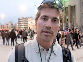 This undated file still image from video released April 7, 2011, by GlobalPost, shows James Foley of Rochester, N.H., a freelance contributor for GlobalPost, in Benghazi, Libya. In a horrifying act of revenge for U.S. airstrikes in northern Iraq, militants with the Islamic State extremist group have beheaded Foley â€” and are threatening to kill another hostage, U.S. officials say. (AP Photo/GlobalPost, File)