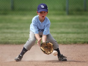 In this file photo, shortstop Miles Walsh, 8, fields the ball while competing in a house league match during the 2nd Annual 100 inning game at Riverside Baseball Park, Saturday, June 22, 2013.  (DAX MELMER/The Windsor Star)