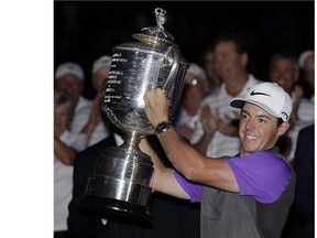 Rory McIlroy of Northern Ireland holds up the Wanamaker Trophy after winning the PGA Championship at Valhalla Golf Club on Sunday in Louisville, Ky.
(David J. Phillip/Associated Press)