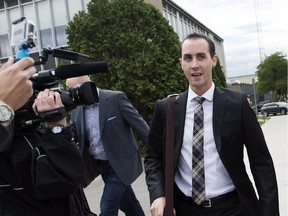 Former Conservative party staffer Michael Sona leaves court in Guelph, Ont. on Thursday, August 14, 2014. Sona was found guilty of trying to prevent voters from voting during the 2011 federal election. THE CANADIAN PRESS/Darren Calabrese