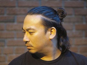 Ariel del Rosario of Edmonton wears his hair in a top knot or "man bun." (POSTMEDIA NEWS)