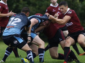The Ontario Blues play the Atlantic Rock in senior men's Canadian Rugby Championship action at Twin Elms Rugby Park in Nepean on August 16, 2014. This is the first time ever a senior men's Canadian Rugby Championship game has taken place in Ottawa. (David Kawai/Postmedia News)