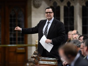 Heritage Minister James Moore responds to a question during question period in the House of Commons on Parliament Hill in Ottawa on Wednesday, June 12, 2013. THE CANADIAN PRESS/Sean Kilpatrick