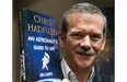 Retired Canadian astronaut Chris Hadfield holds a copy of his new book "An Astronaut's Guide to Life on Earth" while on a media tour in Montreal on November 27, 2013. Former astronaut Chris Hadfield's next adventure may involve prime-time TV. His book, "An Astronaut's Guide To Life On Earth," is the inspiration for a TV pilot being commissioned by ABC. THE CANADIAN PRESS/Ryan Remiorz