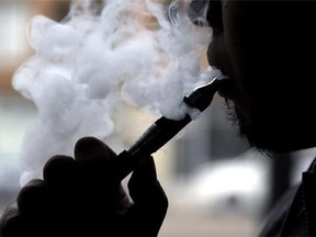 An electronic cigarette is demonstrated in Chicago. In a surprising new policy statement, the American Heart Association backs electronic cigarettes as a last resort to help smokers quit. (AP Photo/Nam Y. Huh, File)