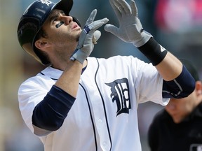 Detroit's J.D. Martinez looks skyward as he crosses home plate after his solo home run off Pittsburgh starting pitcher Francisco Liriano during the fifth inning at Comerica Park. (AP Photo/Carlos Osorio)
