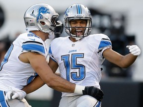Lions wide receiver Golden Tate, right, celebrates with tight end Joseph Fauria after scoring on a 28-yard touchdown reception against the Oakland Raiders Friday in Oakland. (AP Photo/Ben Margot)