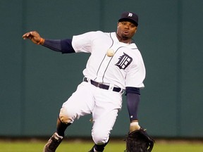 Detroit centre-fielder Rajai Davis dives but misplays a single by Seattle's Robinson Cano during the fifth inning Friday at Comerica Park. (AP Photo/Carlos Osorio)