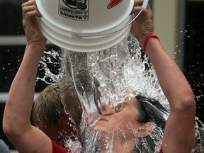 Marshall Maden's face gets distorted while participating in ALS Ice Bucket Challenge at Canadian Tire in Amherstburg, Tuesday August 19, 2014. Maden's father Willy Maden is dealing with ALS and was present for the event. (NICK BRANCACCIO/The Windsor Star)