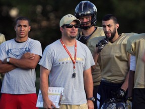 AKO head coach Mike Lachance, centre,  during practice at Windsor Stadium Wednesday August 20, 2014. (NICK BRANCACCIO/The Windsor Star)