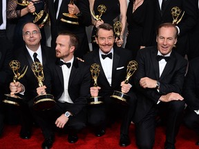 o-executive producer Thomas Schnauz, from left Aaron Paul, Bryan Cranston and Bob Odenkirk pose in the press room with the award for outstanding drama series for "Breaking Bad" at the 66th Annual Primetime Emmy Awards at the Nokia Theatre L.A. Live on Monday, Aug. 25, 2014, in Los Angeles. (Photo by Jordan Strauss/Invision/AP)