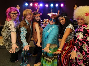 Hana Irving, left, Father Matthew Durham, Laura Lemmon, Laura Durham, Dana Hyde and Suzie Bluhm strike a pose during Boogie Bash dance for Hospice held at Giovanni Caboto Club of Windsor Friday August 22, 2014. (NICK BRANCACCIO/The Windsor Star)